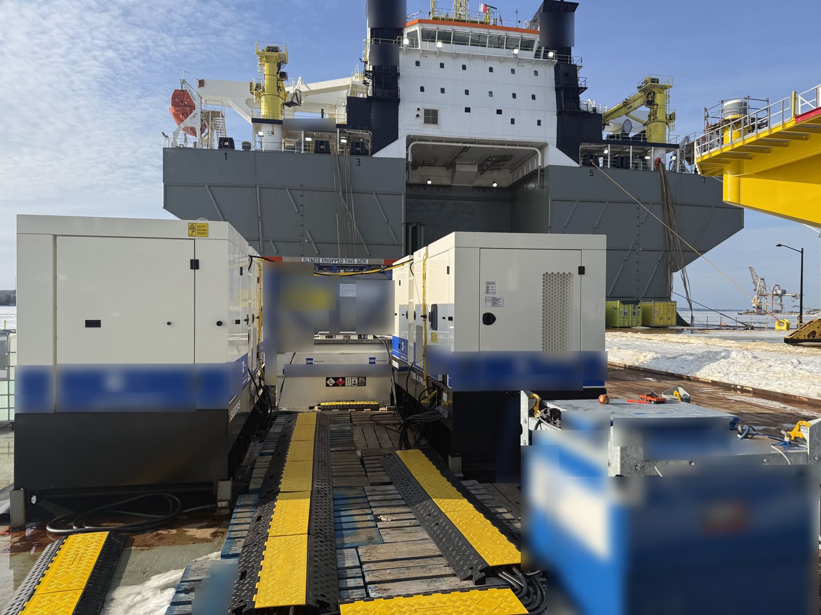 Generators and fuel systems mobilised quayside ahead of an offshore installation vessel